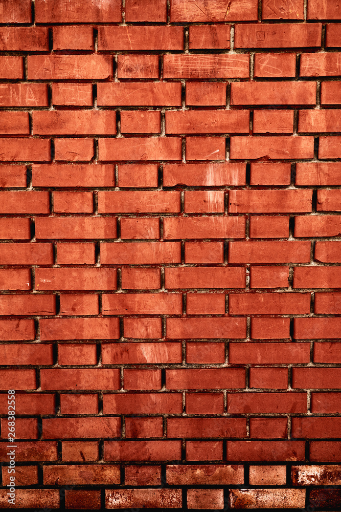 Fototapeta premium Worn weathered red dirty brick wall background backdrop. Close up