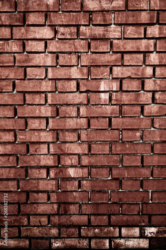 Worn weathered red dirty brick wall background backdrop. Close up