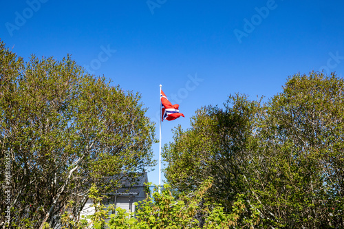 Flags in front of blue sky