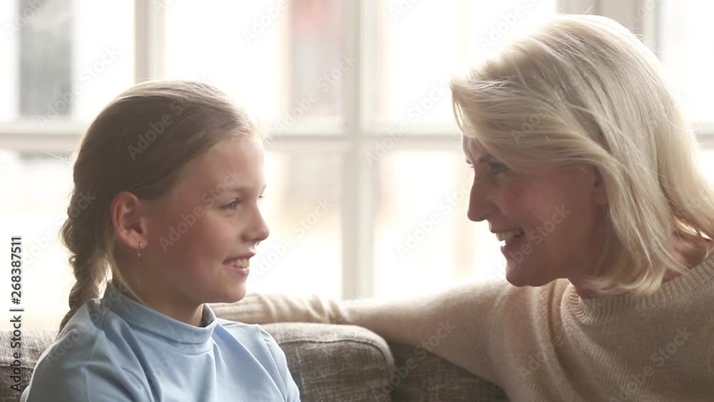 Loving old grandma and granddaughter talking having trust conversation Loving old grandma and granddaughter talking having trust conversation