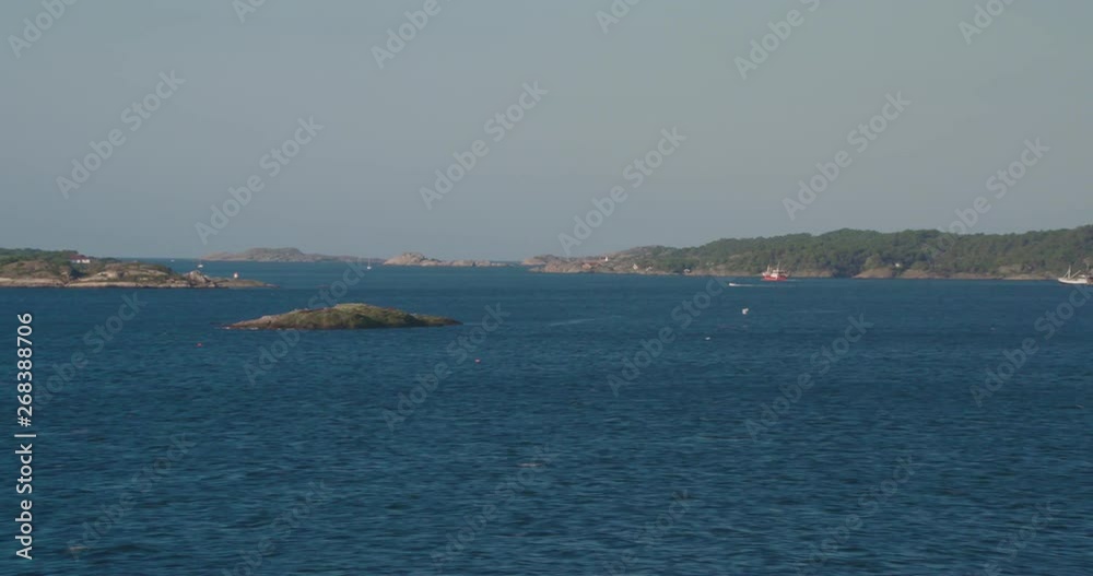 Coast with rocks and canals and fishing boat Coast with rocks and canals and fishing boat