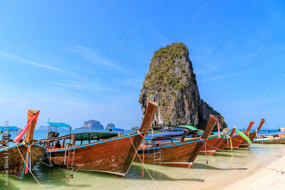Beautiful clear turquoise blue sea and boats at Ao Phra Nang near Railay beach, Krabi, Thailand Beautiful clear turquoise blue sea and boats at Ao Phra Nang near Railay beach, Krabi, Thailand