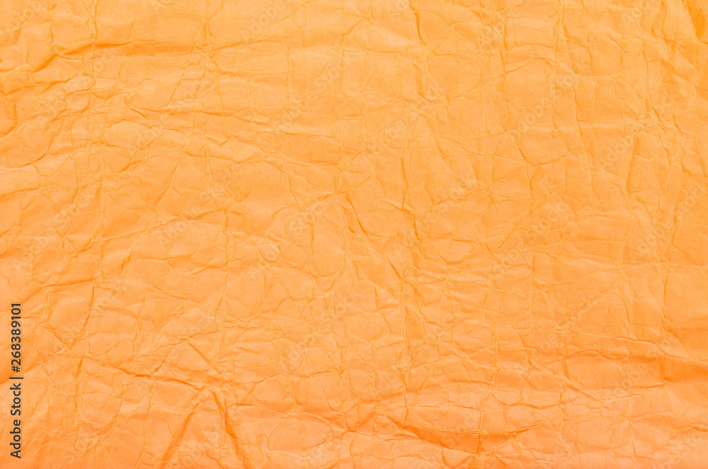 Obraz premium Background of orange crumpled paper