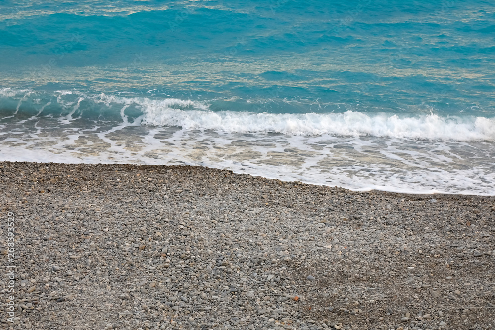 A gentle wave is approaching the beach A gentle wave is approaching the beach