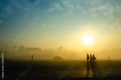 silhouette of people Jogging  in sunrise on the way