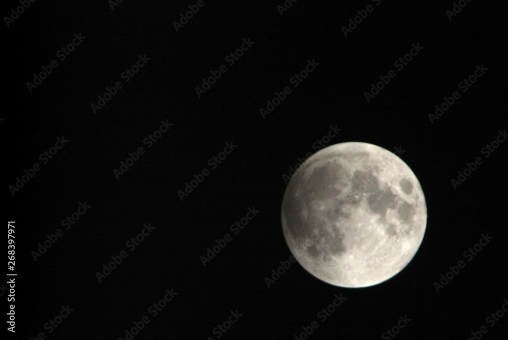 View, of a phase, of the lunar eclipse through a telephoto lens in Turin, Italy View, of a phase, of the lunar eclipse through a telephoto lens in Turin, Italy