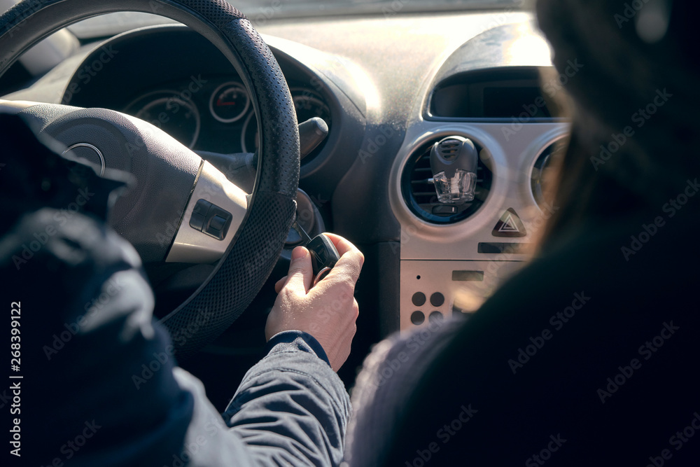 photograph of the driver entering the keys of the car to start it, Granada, Spain photograph of the driver entering the keys of the car to start it, Granada, Spain