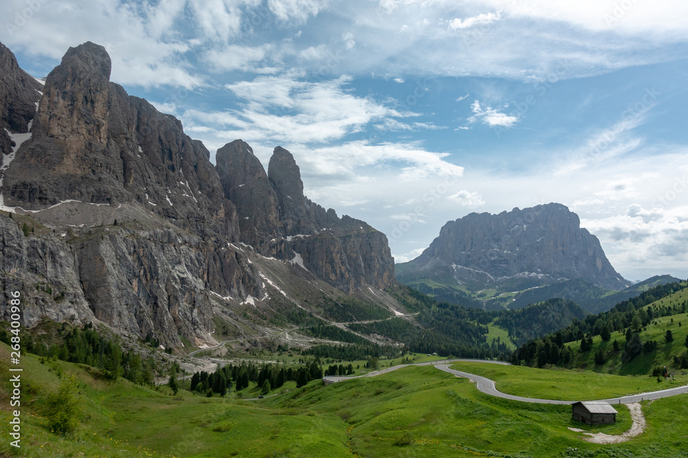 Italian dolomites mountain road with peaks in background
