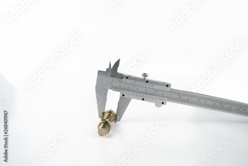 vernier caliper metal measuring nut and bolt on plain isolated white background