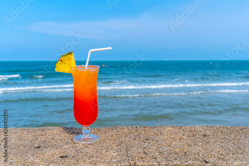 Fruit punch on the beach, refreshing fruit punch mocktail and summer drinks.