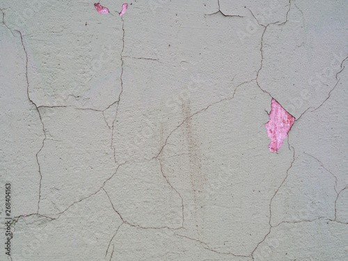 Old cracked paint on the concrete wall