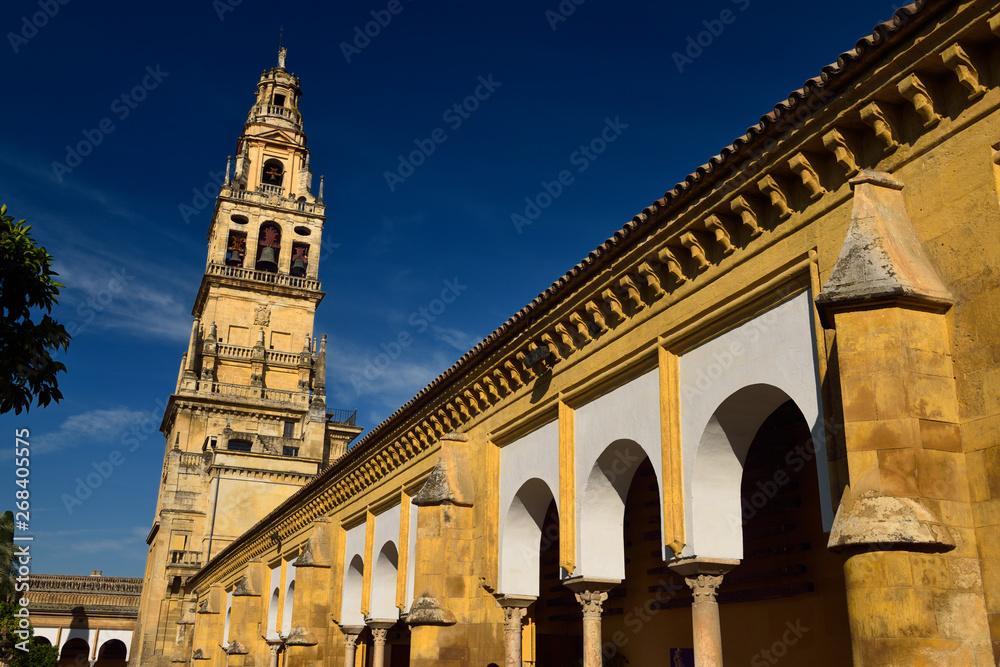North side of the Cordoba Cathedral Mosque with bell tower topped by Archangel Raphael