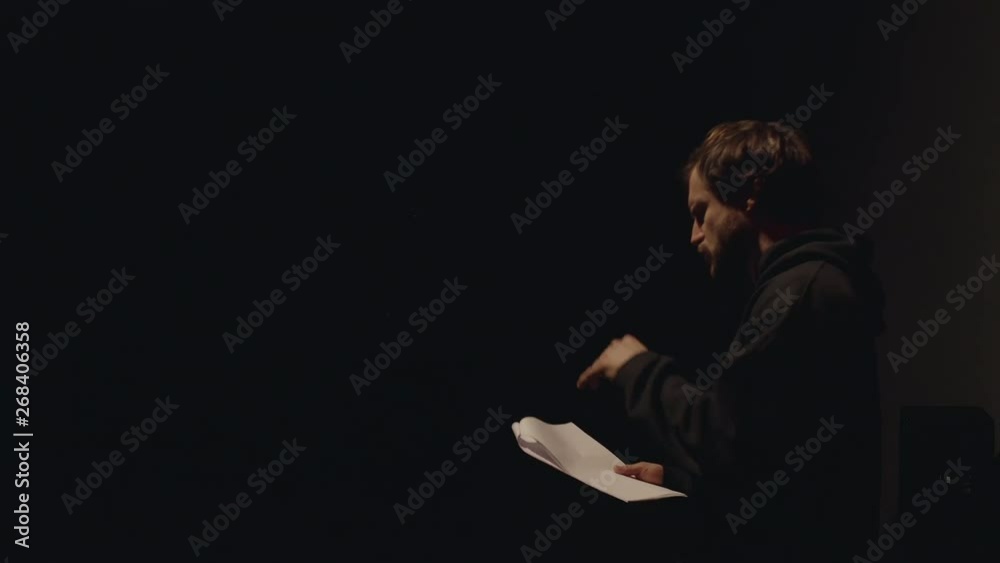 Actor in a theatre reviewing the script
