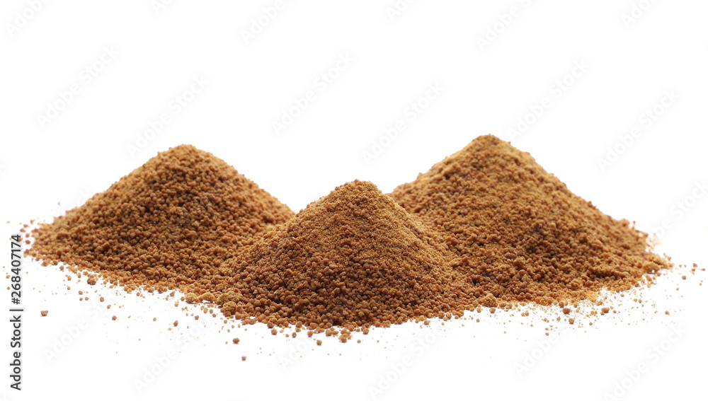 Pile coconut palm sugar isolated on white Pile coconut palm sugar isolated on white