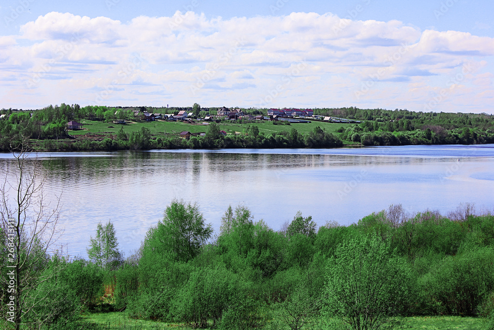 Sheksna River with houses on the other side Sheksna River with houses on the other side