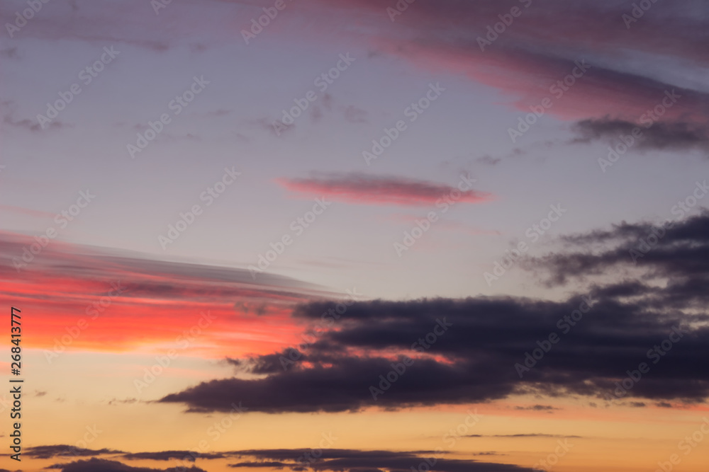 Stunning vivid multiple colors of clouds on a dramatic sunset sky
