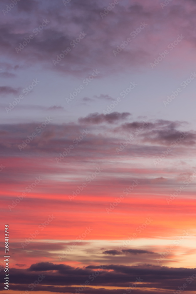 Stunning vivid multiple colors of clouds on a dramatic sunset sky