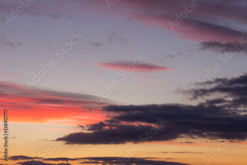 Stunning vivid multiple colors of clouds on a dramatic sunset sky