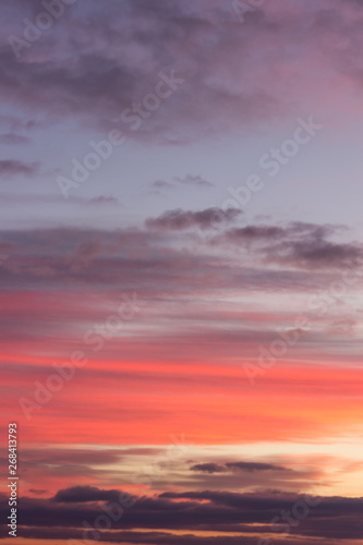 Stunning vivid multiple colors of clouds on a dramatic sunset sky © Nikola