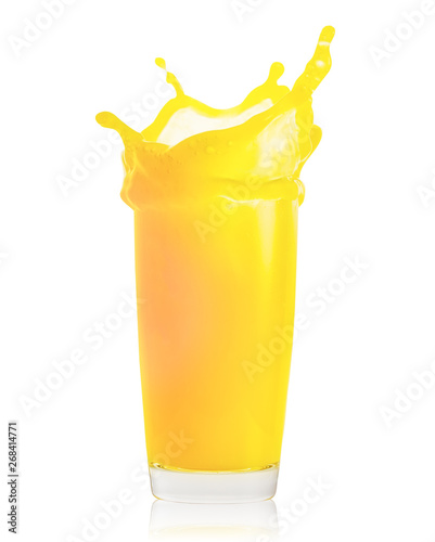Splash of fresh orange juice in transparent glass isolated on white background