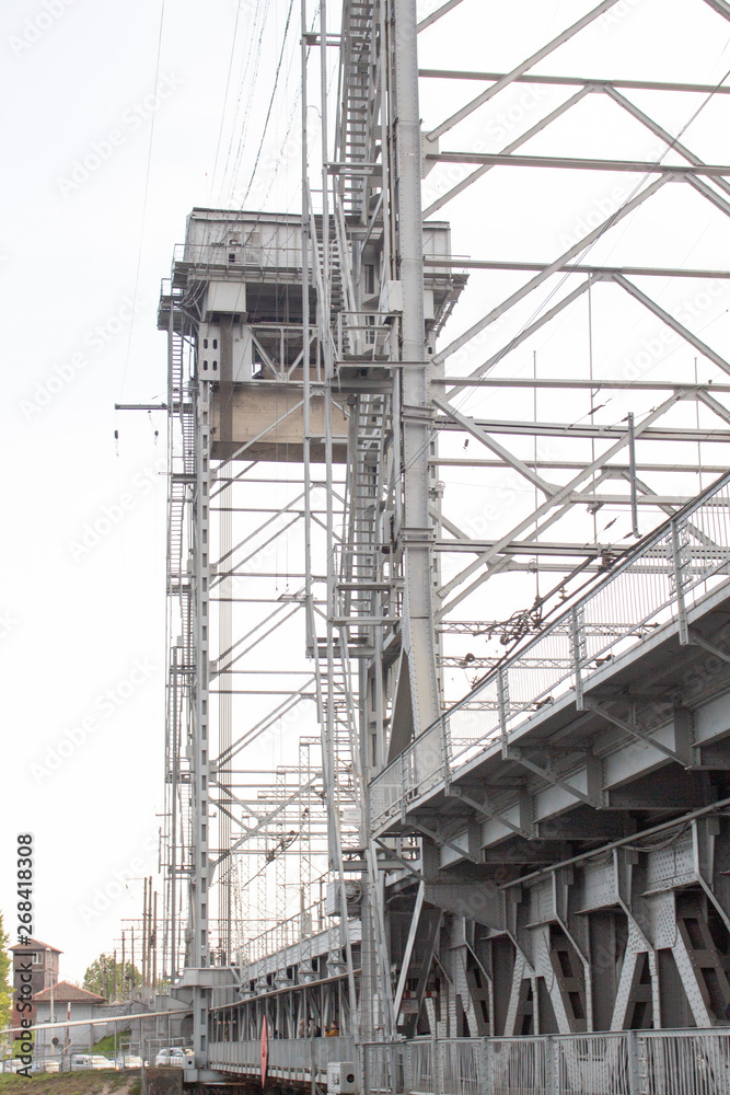 metal gray structures of the railway bridge