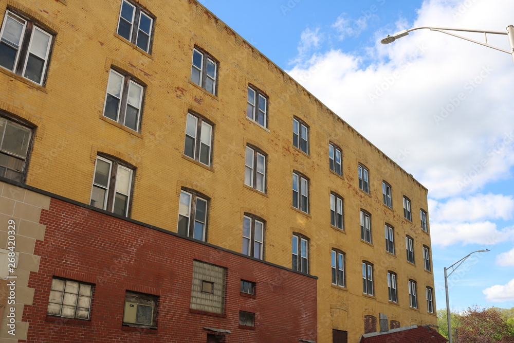 Vacant brick apartment building in urban neighborhood 