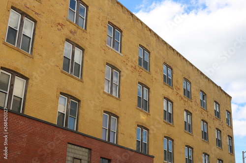 Vacant brick apartment building in urban neighborhood 