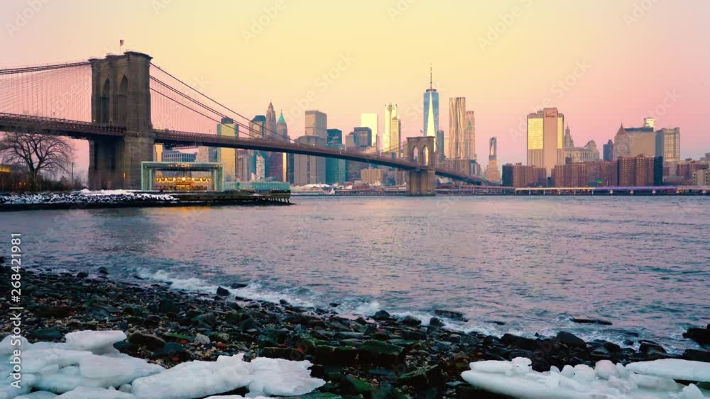 Panoramic view of Brooklyn bridge and Manhattan at sunrise, New York City. Panoramic view of Brooklyn bridge and Manhattan at sunrise, New York City.
