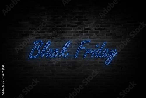 Black Friday sale. Modern neon blue billboard on brick wall.