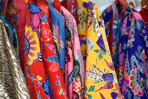 Colourful red, blue and yellow kimono's in Naha Okinawa Japan © MartinZizlavsky