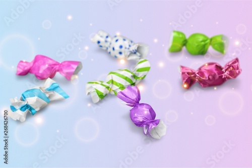 Assortment of wrapped candies  on white background © BillionPhotos.com