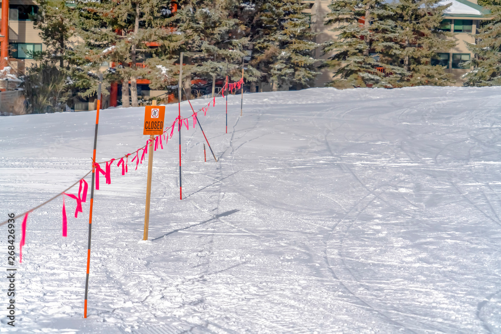 Barricade with a Closed sign viewed on a sunny winter day in Park City Utah Barricade with a Closed sign viewed on a sunny winter day in Park City Utah