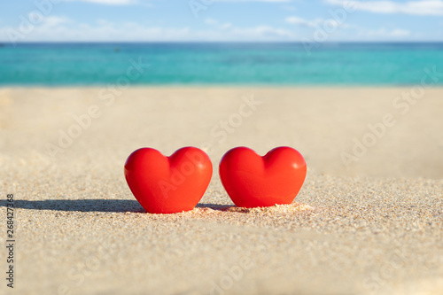 Two Red Heart Shape On Sand At Beach