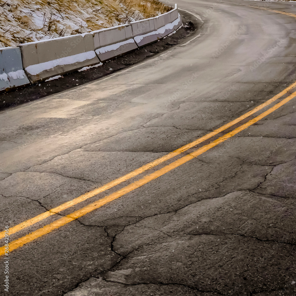 Clear Road with cracks in Salt Lake City in winter Clear Road with cracks in Salt Lake City in winter