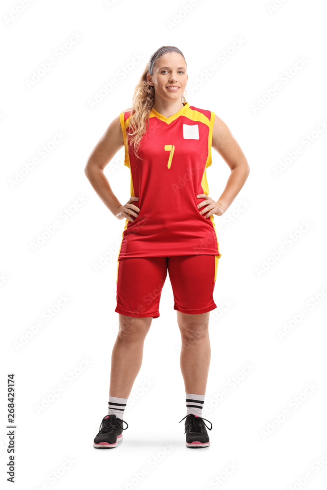 Female basketball player posing and smiling at the camera Female basketball player posing and smiling at the camera