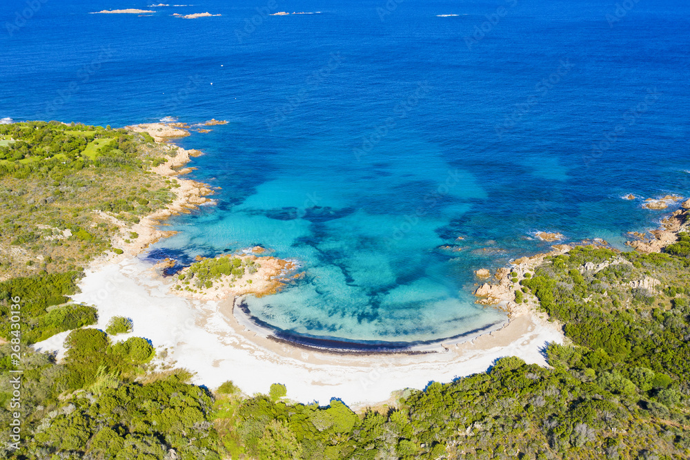 View from above, stunning aerial view of the Prince Beach (Spiaggia del Principe) bathed by a beautiful turquoise sea. Costa Smeralda (Emerald Coast) Sardinia, Italy.