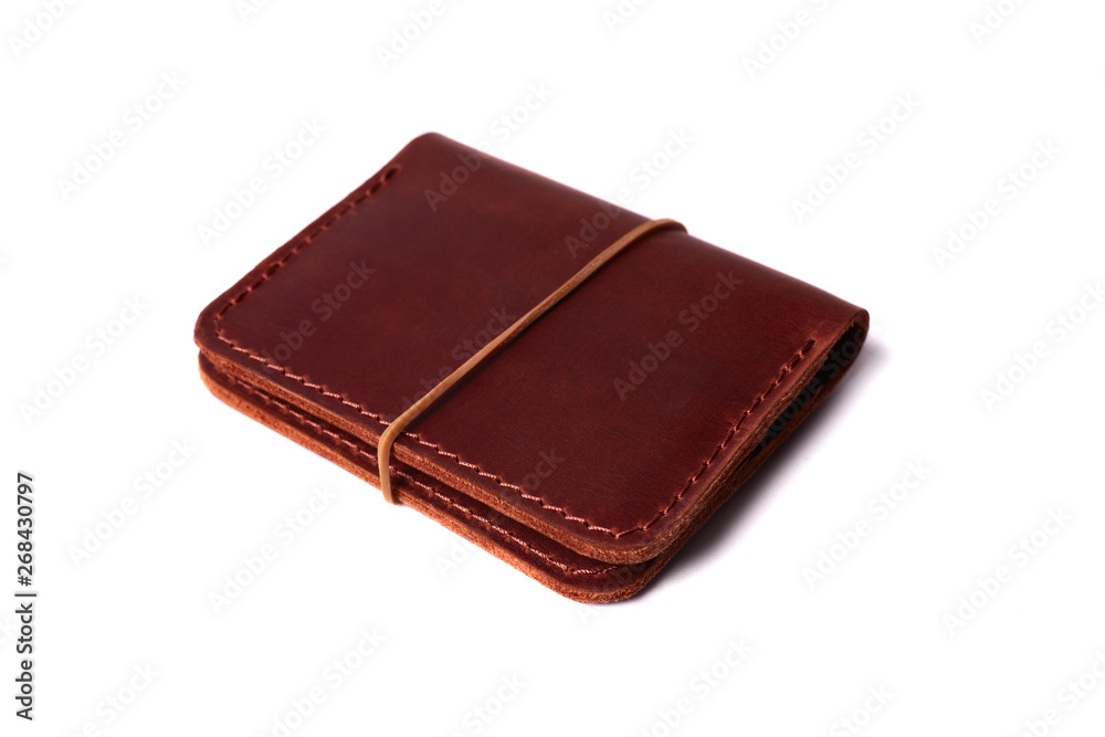 Handmade red color leather cardholder with rubber band isolated on white background closeup. Stock photo of handmade luxury accessories. Handmade red color leather cardholder with rubber band isolated on white background closeup. Stock photo of handmade luxury accessories.