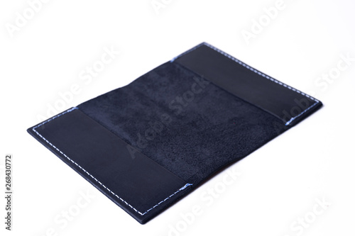 Blue handmade leather passport cover isolated on white background. Cover is open. Stock photo of luxury businessman accessories.