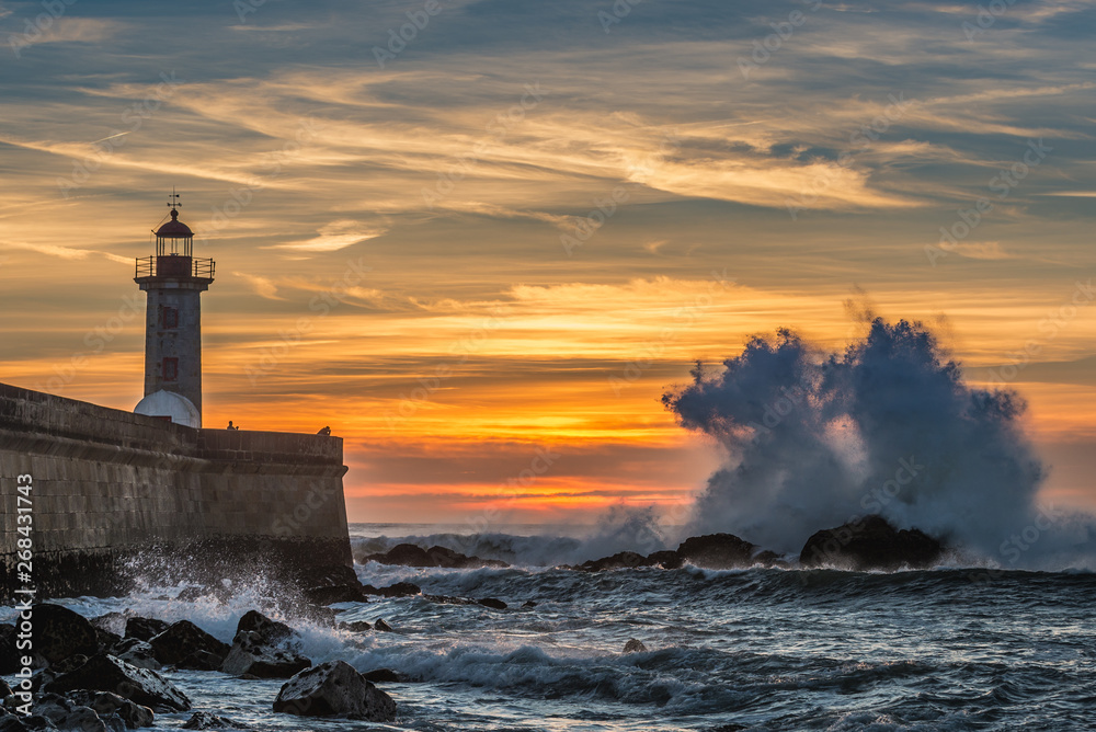 Sunset over Atlantic Ocean and Felgueiras Lighthouse in Porto city, Portugal