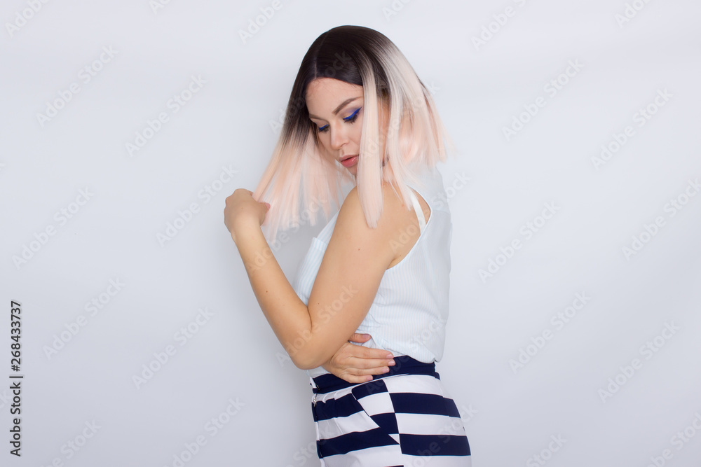Lovely blonde woman wearing summer shorts and blouse Lovely blonde woman wearing summer shorts and blouse