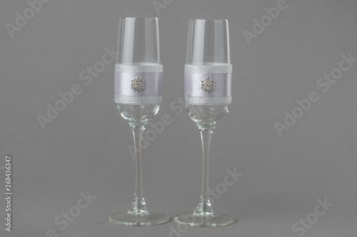 Two fashion decorated wedding wine glasses .