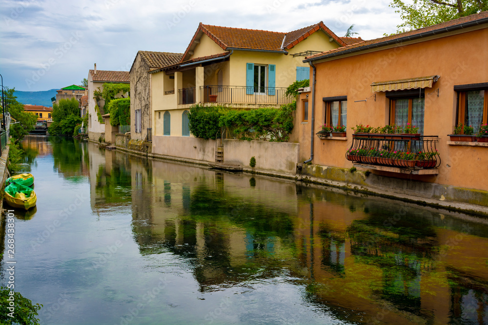 Tourist and vacation destination, small Provencal town lIsle-sur-la-Sorgue with green water of Sotgue river