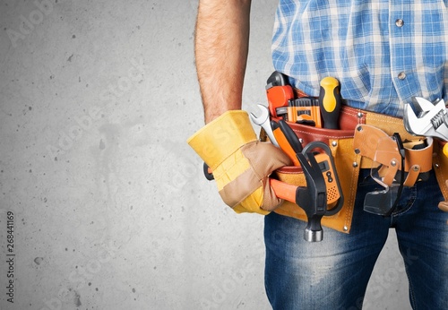 Bild auf Leinwand Worker with a tool belt
