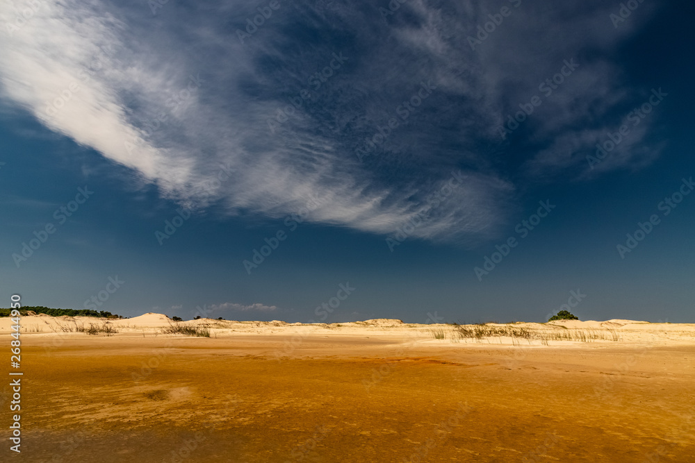 dunes in the desert under the clouds