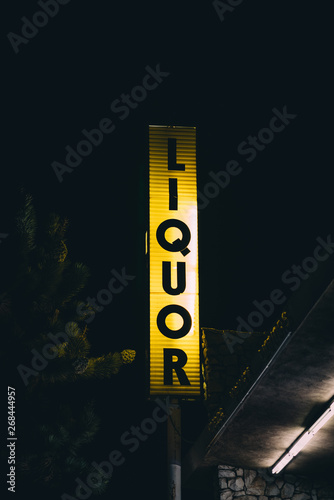 Liquor store sign at night, in Yucca Valley, California