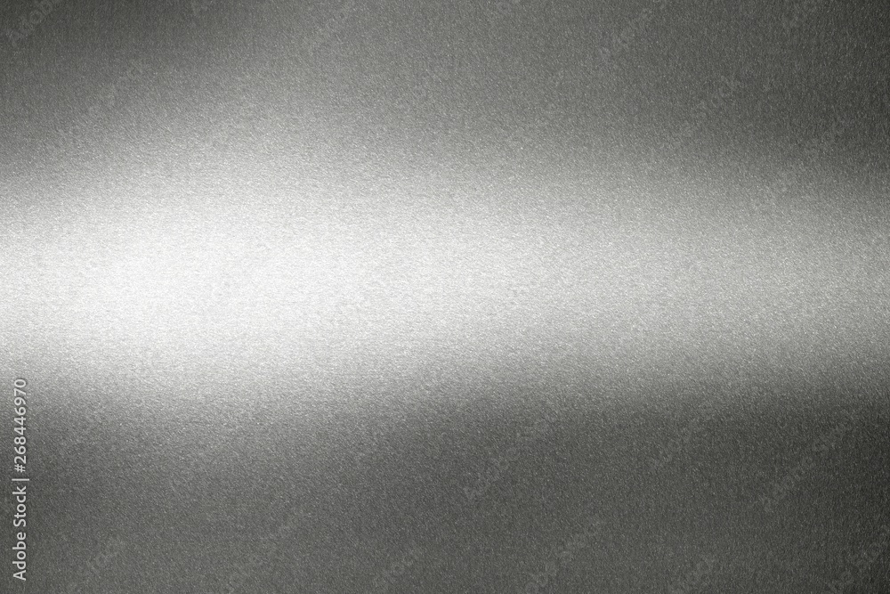 Light shining on black metal wall, abstract texture background Light shining on black metal wall, abstract texture background