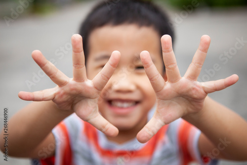 children smiling face show ten finger by two hand © stockphoto mania