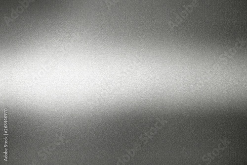 Light shining on black metal wall, abstract texture background