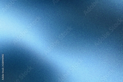 Light shining on blue steel wall surface, abstract texture background