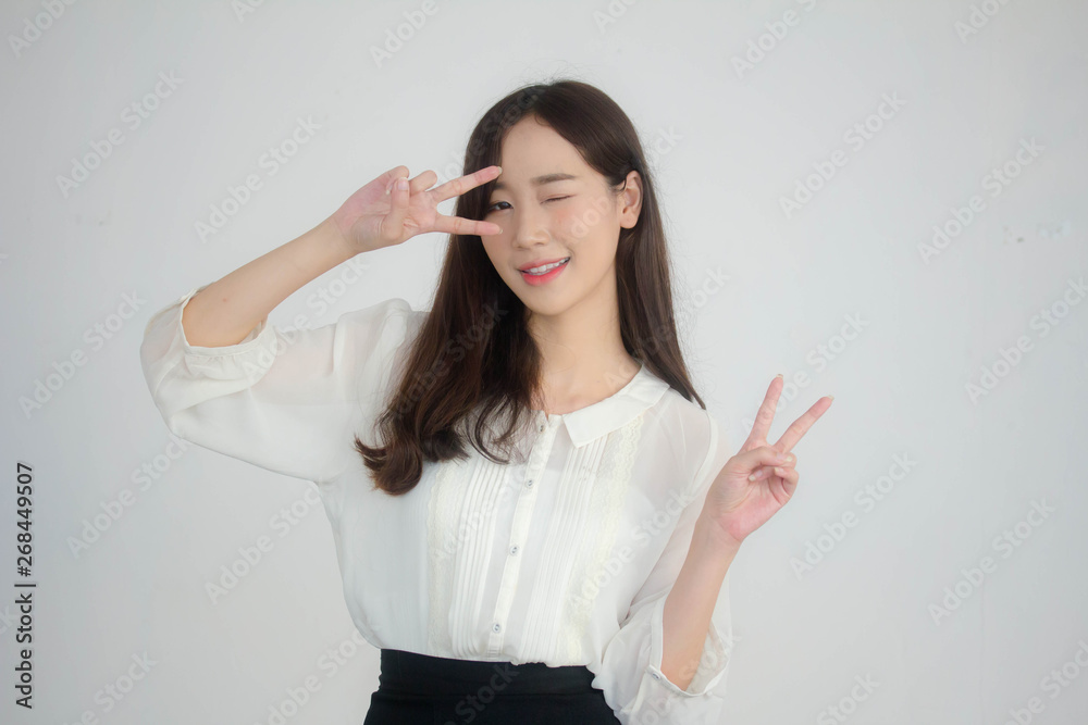 Portrait of thai adult working women white shirt victory Portrait of thai adult working women white shirt victory